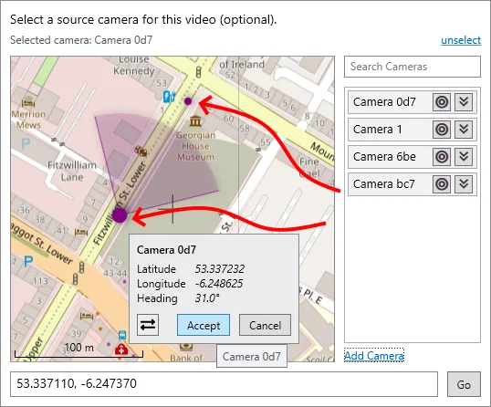 Dragging a camera by its base point and adjusting its viewing cone, then clicking Accept.