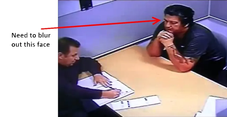 A police interview video, with a note pointing to the face that needs to be blurred.