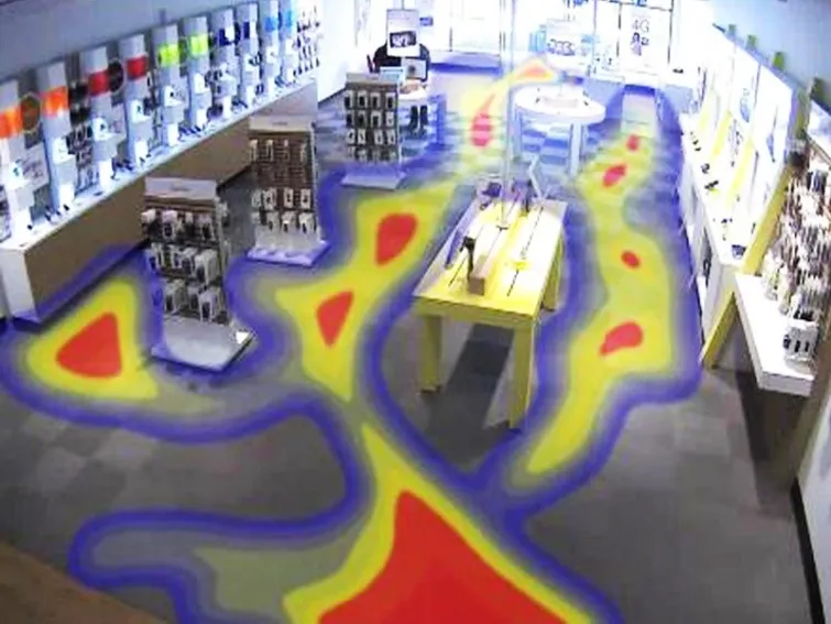 Overhead camera view of a phone shop with a colour heat map overlaid on the floor, red where customers spent most time and blue where they spent least.