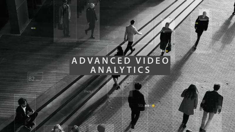 Black-and-white overhead view of pedestrians crossing a plaza, each outlined by a detection box, under the caption "Advanced Video Analytics".