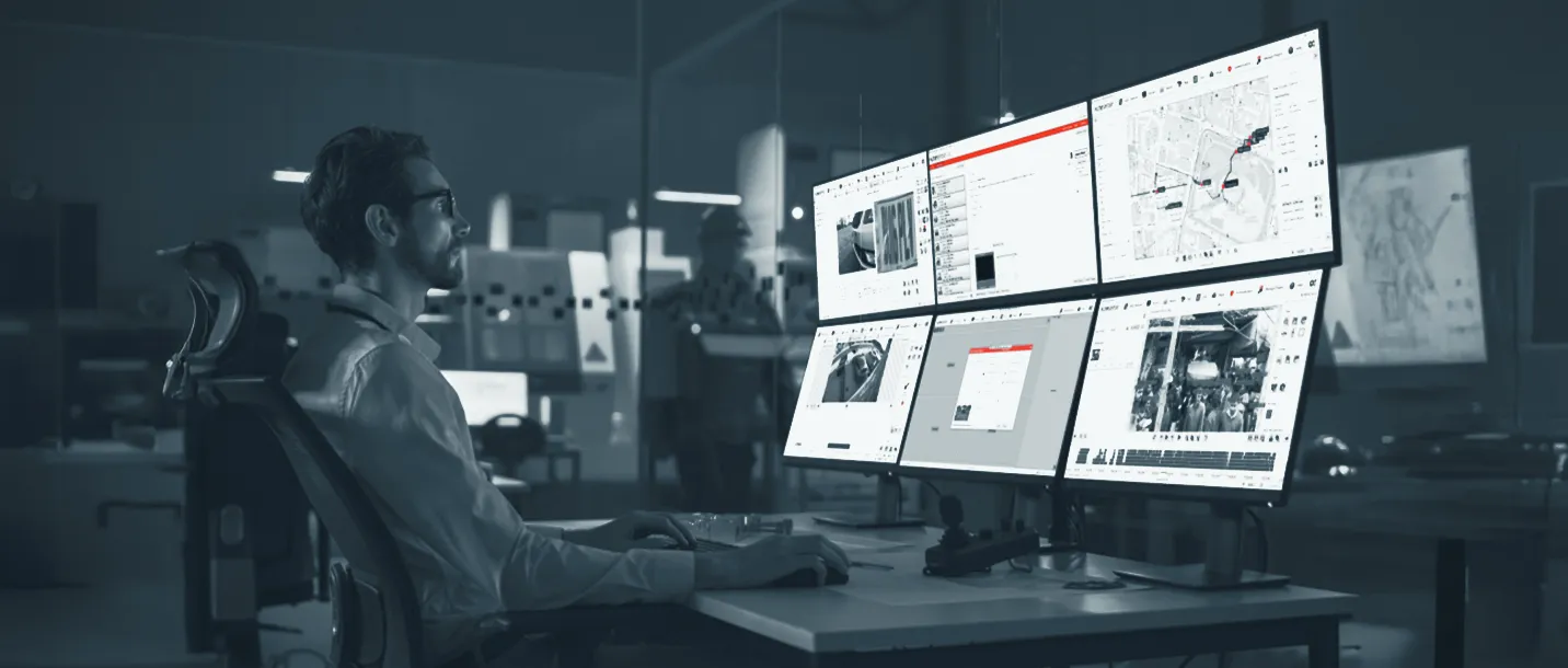 A control room operator reviewing multiple video feeds
